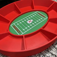 a red tray with a football field on it