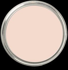 an empty white plate on a black background with some light pink paint in the middle