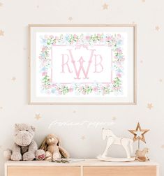 a baby's nursery room with flowers and stars on the wall, teddy bears and a framed monogrammed poster