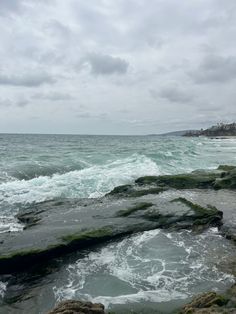 waves crashing on rocks in the ocean