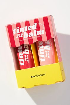 These multi-use balms melt into skin for a wash of blendable, buildable, beautiful color. | Duo Lip & Cheek Tinted Balm Set by AvryBeauty in Red at Anthropologie Colorful Product Packaging, Fancy Makeup Packaging, Unique Makeup Packaging, Lip Tint Packaging Ideas, Holi Packaging, Lip Balm Packaging Ideas, Makeup Packaging Ideas, Lip Balm Design, Fun Packaging Design