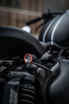 a close up of a motorcycle with the light on