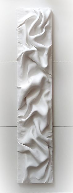 an abstract piece of art made out of white paper