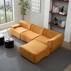 a modern living room with an orange couch