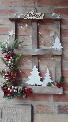 a wooden frame with christmas decorations on it