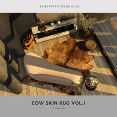 an image of a living room setting with cow skin rug vol 1 on the floor