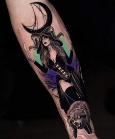 a woman wearing a witches hat and holding a wolf tattoo on her arm with the moon behind her