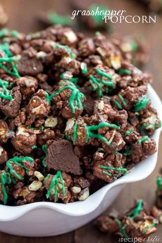 a white bowl filled with chocolate and green sprinkles