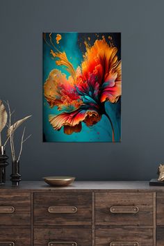 an abstract flower painting on a wall above a wooden dresser with drawers and vases