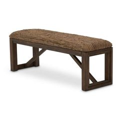 a bench made out of wood with a woven seat pad on the top and bottom