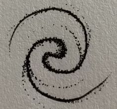 the letter s is drawn in black ink on a white paper with a circular design