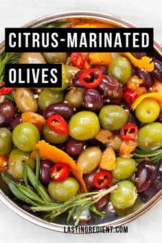 a bowl filled with olives and peppers next to the words citrus marinated olives