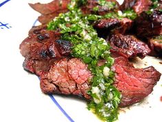 steak with herbs and sauce on a plate