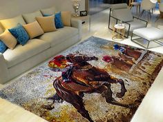 a living room area with couches, chairs and rugs on the floor that has a painting of two horses racing each other