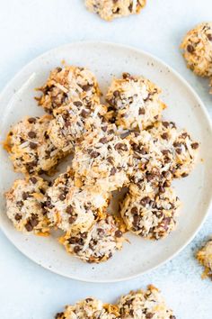 a white plate topped with cookies and chocolate chips