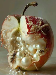 an apple covered in pearls and other things