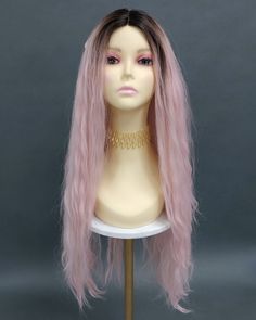 "Low-density long and wavy lace front wig with a fixed lace center part. Inside cap has 1 back comb and adjustable elastic straps. Heat resistant at 350F. Color: Light Pink with Dark Roots (TTPink) Length: 33\" Inches Circumference: Default at 21\" with adjustable cap (max 22\") Materials: Heat Resistant Synthetic Wig Fibers All sales are final. Please read all store policies before purchasing." Back Combing, Center Part, Dark Roots, Synthetic Wig, Remy Hair, Styling Tools, 100 Human Hair, Synthetic Wigs, Human Hair Wigs