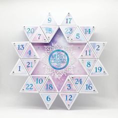 a snowflake shaped clock with numbers on it