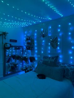 a bedroom with blue lights on the ceiling