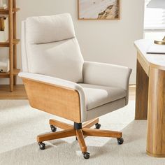 an office chair sitting on top of a white carpeted floor next to a desk