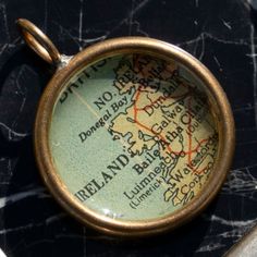 a close up of a magnifying glass on a marble surface