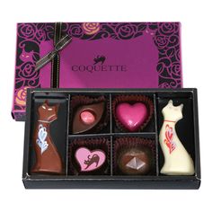 assorted chocolates in a gift box with pink and purple decorations on the side