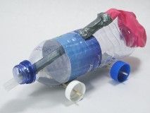 a plastic water bottle with a spigot attached to it