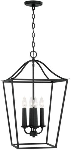 a black chandelier with three candles hanging from the bottom and one light on top