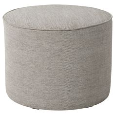 the round ottoman is made out of fabric