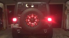 the back end of a jeep with red lights