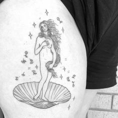 a woman with long hair standing on top of a scallop shell tattoo design