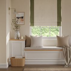 a window seat with pillows on it in front of a window