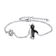 PRICES MAY VARY. 💖 Design: A cute animal bracelet from the penguin collection.Made with 925 sterling silver plus with AAA+ black cubic zirconia,classical, cute and fashion.It's fit any occasion. 💖 Material: 925 sterling silver penguin jewelry,hypoallergenic, tarnish resistant,nickel-free,lead-free,cadmium-free,suitable for long-term wear,not contain any allergic element. 💖 Size: Penguin bracelet length:7+2 inch adjustable extension chain.Packaging: 1x penguin jewelry; 1 x polishing cloth and Snowflake Gifts, Penguin Bracelet, Sloth Jewelry, Penguin Jewelry, Snowflake Bracelet, Animal Bracelet, Sloth Gift, Valentine's Day Party, The Penguin