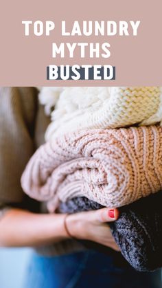 a woman holding several sweaters in her hands with the words top laundry myths busted