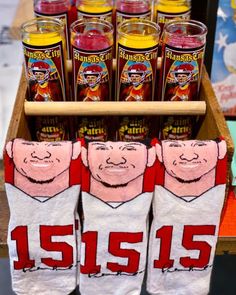 socks with pictures of football players on them are displayed in a display case at a store