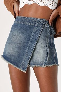 Your spring style just wouldn't be the same without the Free People Emmy Medium Wash Side-Tie Wrap Denim Skort making a stylish appearance! Sturdy, medium wash denim (in Free People's Misty Blue wash) shapes this ultra-trendy skort that features a high-rise fit and an asymmetrical design. An overlapping panel wraps atop flirty shorts and secures with a cute side tie before falling to a raw mini hem. Back patch pocket. Hidden front zipper. Fit: This garment fits true to size. Length: Above mid-th Trendy Skort, Bougie Outfits, Cute Bottoms, Bright Outfits, Denim Skort, Wrap Skort, Nashville Outfits, Lulu Fashion, Tie Wrap