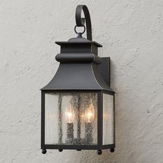 three light outdoor wall lantern in an old - fashioned style with frosted glass panels