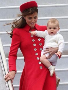 the duke and princess of cambridge with their baby son, prince george at an airport