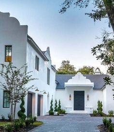 a white house with black doors and windows