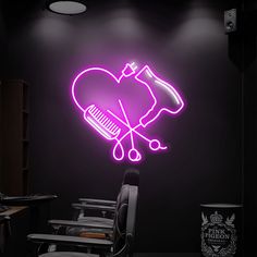 a neon pink heart with scissors and combs in the shape of a heart on a black wall