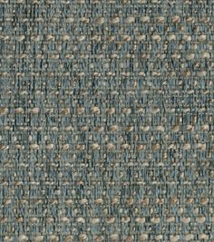 an upholstered blue and grey carpet with small dots on it's surface