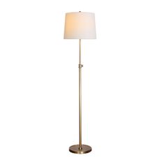 a floor lamp with a white shade on it