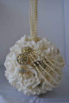 a bridal bouquet with pearls and flowers