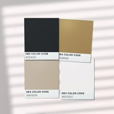 three different shades of black, beige, and white paint on the same color palette