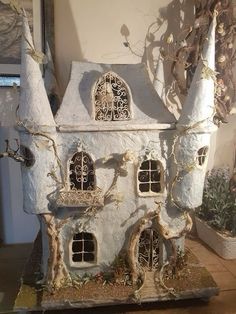 a doll house made to look like it is in the shape of a fairy tale