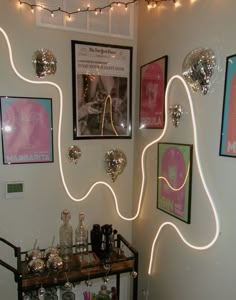 a room with lights and pictures on the wall