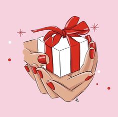 a woman's hands holding a gift box with red nail polish