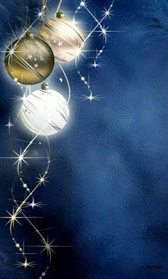 three ornaments hanging from strings against a blue background with stars and sparkles in the air