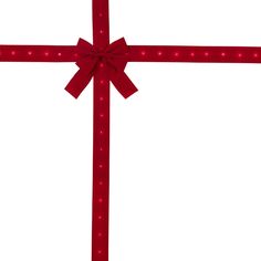 a red bow with lights around it on a white background is the center piece of this image