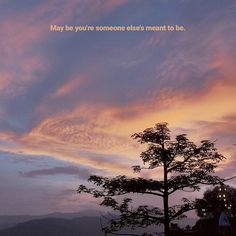 the sky is pink and blue with clouds in it, as well as a tree